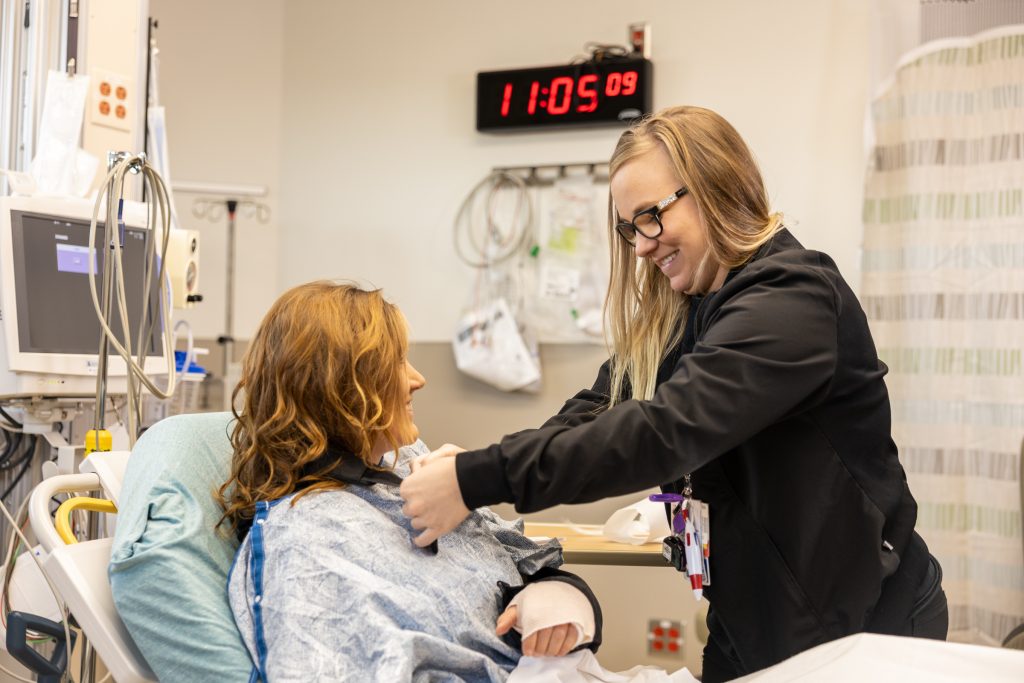 A nurse helps a patient at Grand Lake Health System.